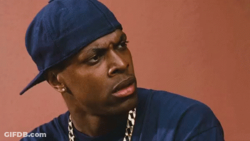 Close Up Of Man Wearing Blue Hat And Gold Chain GIF