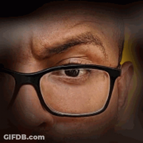 Close Up Of Man Wearing Glasses Making Funny Face GIF