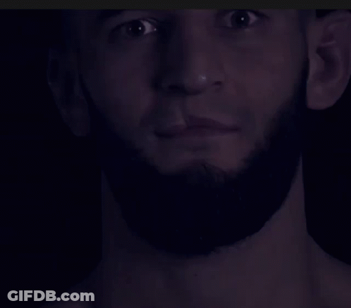 Close Up Of Man With Beard In Dark GIF