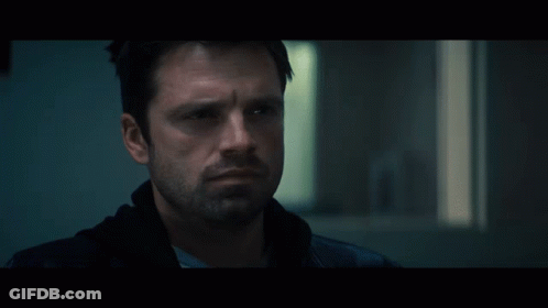 Close Up Of Man With Beard In Dark Room GIF