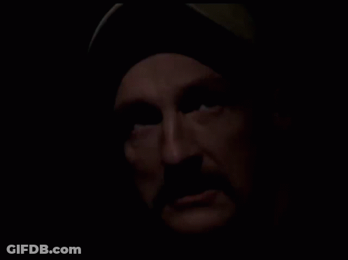 Close Up Of Man With Beard In Dark GIF