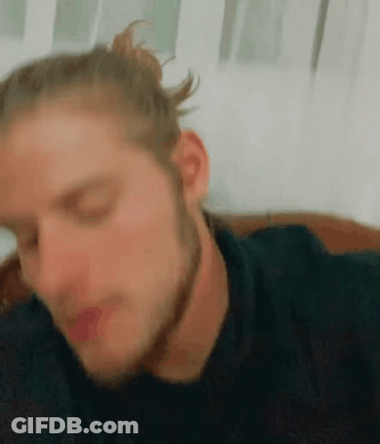 Close Up Of Man With Bun On Hair GIF