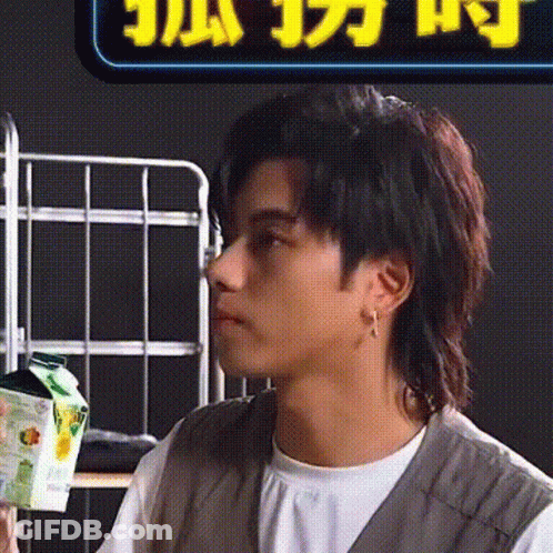 Close Up Of Man With Chinese Sign GIF