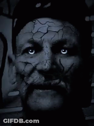 Close Up Of Man With Cracked Face And Beard GIF