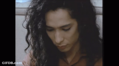 Close Up Of Man With Long Curly Hair GIF