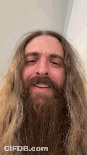 Close Up Of Man With Long Hair And Beard Smiling GIF