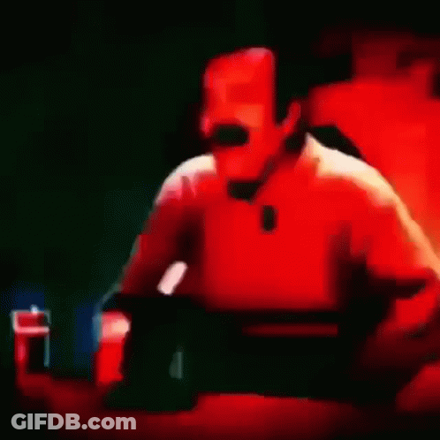 Close Up Of Man With Mustache Laughing In Red Light GIF