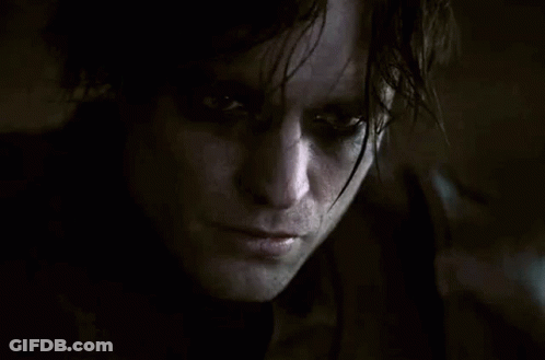 Close Up Of Man With Serious Look In Dark Room GIF