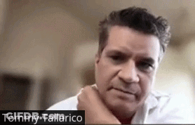 Close Up Of Man With Tommy Tallarico Written Below GIF