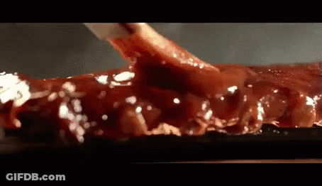 Close Up Of Meat Covered In Sauce GIF
