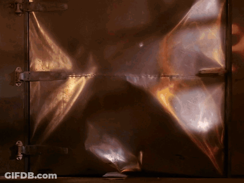 Close Up Of Metal Door With Light Reflection GIF