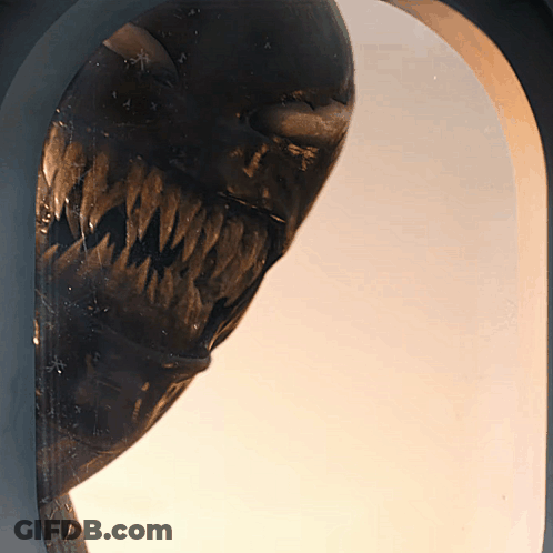 Close Up Of Monster Statue With Large Mouth GIF