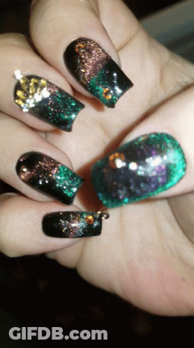 Close Up Of Nails With Black And Green Polish GIF