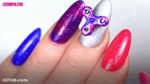 Close Up Of Nails With Fidget Spinner GIF