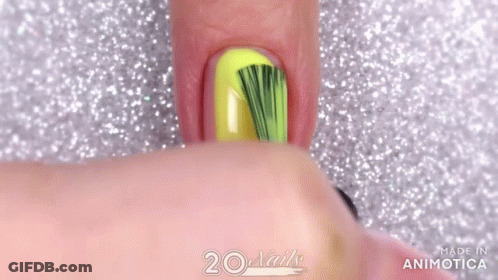 Close Up Of Nails With Yellow And Black Polish GIF