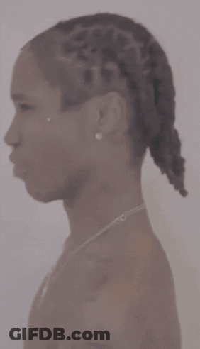 Close Up Of Neck With Braids And Necklace GIF
