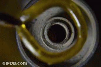 Close Up Of Oil Bottle With Yellow Liquid GIF