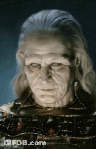 Close Up Of Old Man With Gray Hair And Blue Eyes GIF