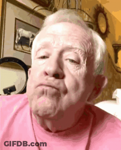 Close Up Of Older Man In Blue Shirt GIF