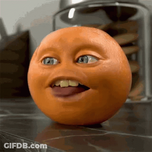 Close Up Of Orange With Funny Face GIF