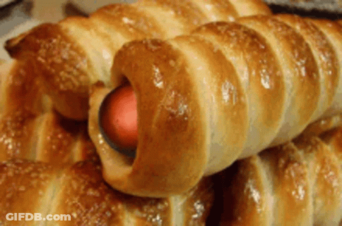 Close Up Of Pastry With Hot Dog Inside GIF