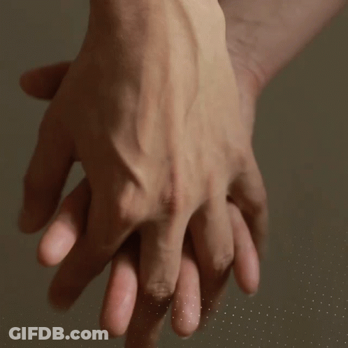Close Up Of People Holding Hands GIF