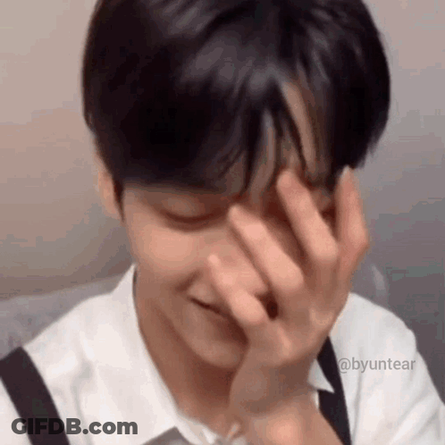 Close Up Of Person Covering Face With Hands GIF