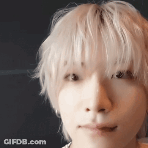 Close Up Of Person Face With Blonde Hair And Earrings GIF