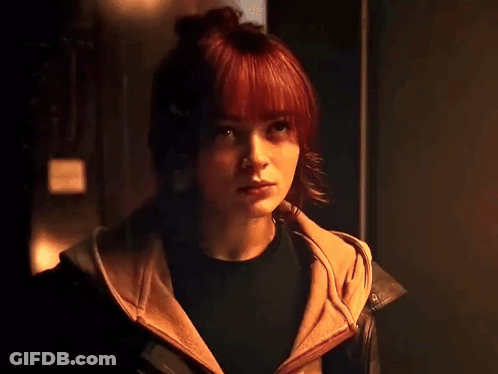 Close Up Of Person Face With Sign GIF