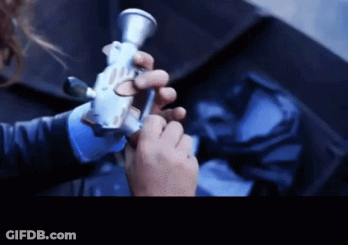 Close Up Of Person Holding Gun GIF
