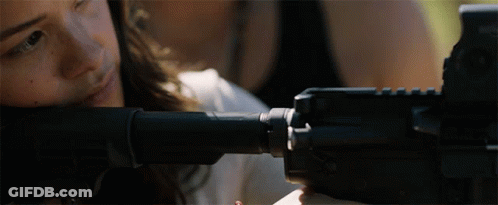 Close Up Of Person Holding Gun With Bullet GIF