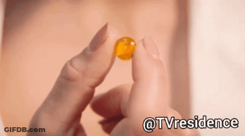 Close Up Of Person Holding Pill With Hashtag @Tvresidence GIF