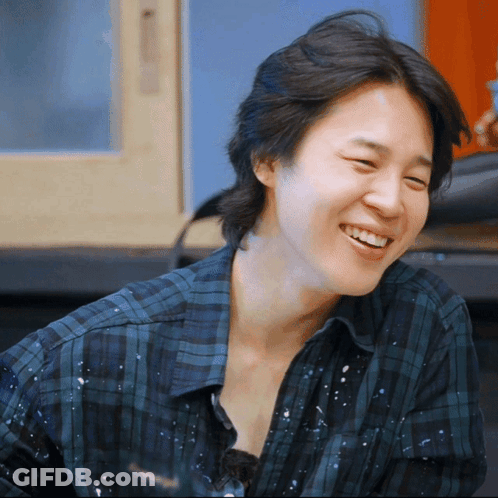 Close Up Of Person In Plaid Shirt Smiling GIF