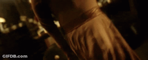 Close Up Of Person's Arm In Dark Room GIF