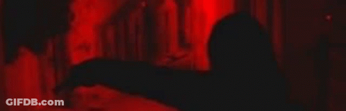 Close Up Of Person's Eyes In Red Light GIF