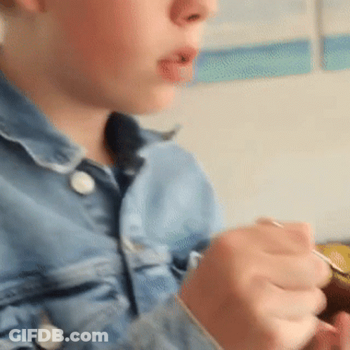 Close Up Of Person's Face And Hands GIF
