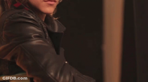 Close Up Of Person's Face In Black Leather Jacket GIF