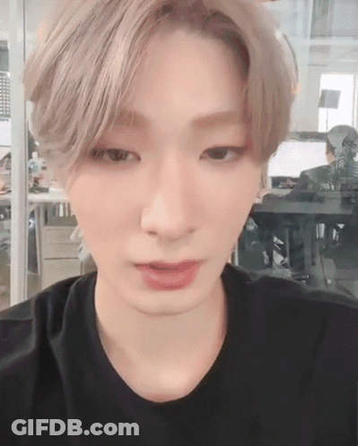 Close Up Of Person's Face In Black Shirt GIF