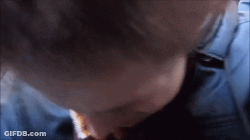 Close Up Of Person's Face In Blue Shirt GIF