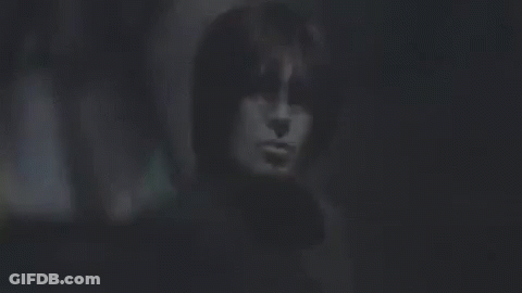 Close Up Of Person's Face In Dark GIF