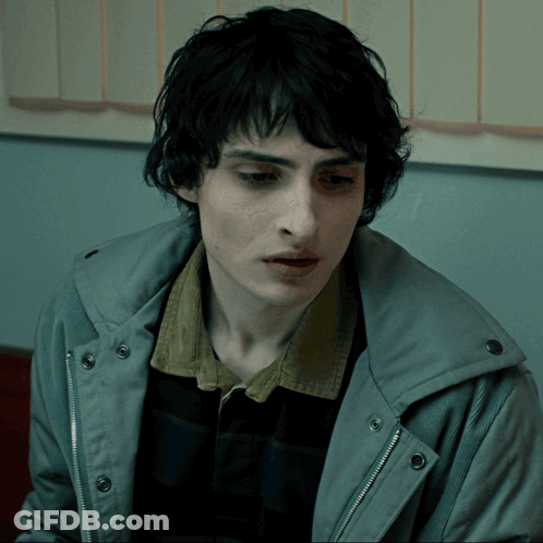 Close Up Of Person's Face In Grey Jacket GIF