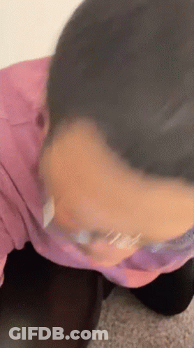 Close Up Of Person's Face In Pink Shirt GIF