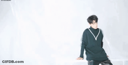 Close Up Of Person's Face In Sweater GIF