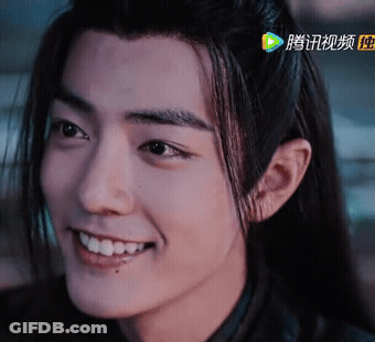 Close Up Of Person's Face With Chinese Writing GIF