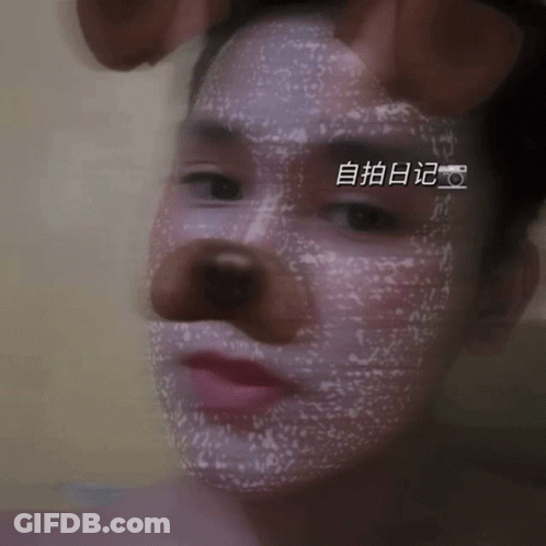 Close Up Of Person's Face With Chinese Writing GIF