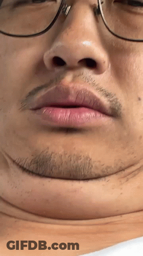 Close Up Of Person's Face With Glasses And Beard GIF