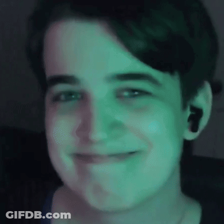 Close Up Of Person's Face With Green Light GIF