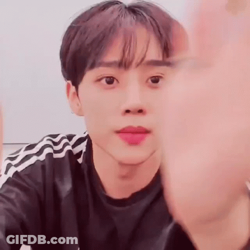 Close Up Of Person's Face With Hand In Front GIF
