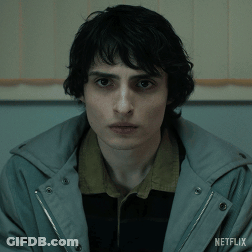 Close Up Of Person's Face With Netflix Logo GIF