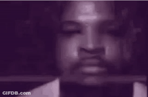 Close Up Of Person's Face With Purple Background GIF